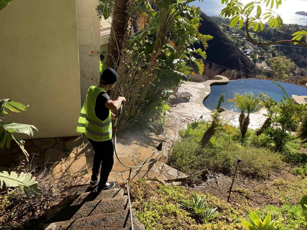 Fire ash cleaning in patio with power washer