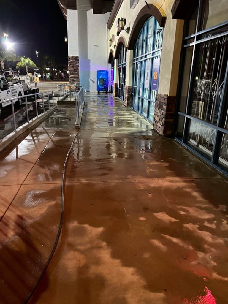 pressure cleaning curb of a strip mall