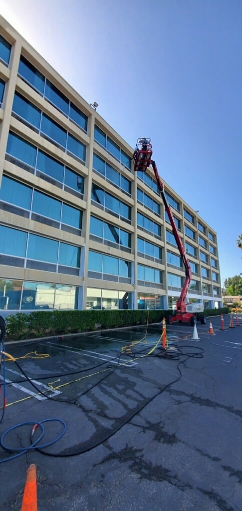 side view of corporate building power washing with elevation tool