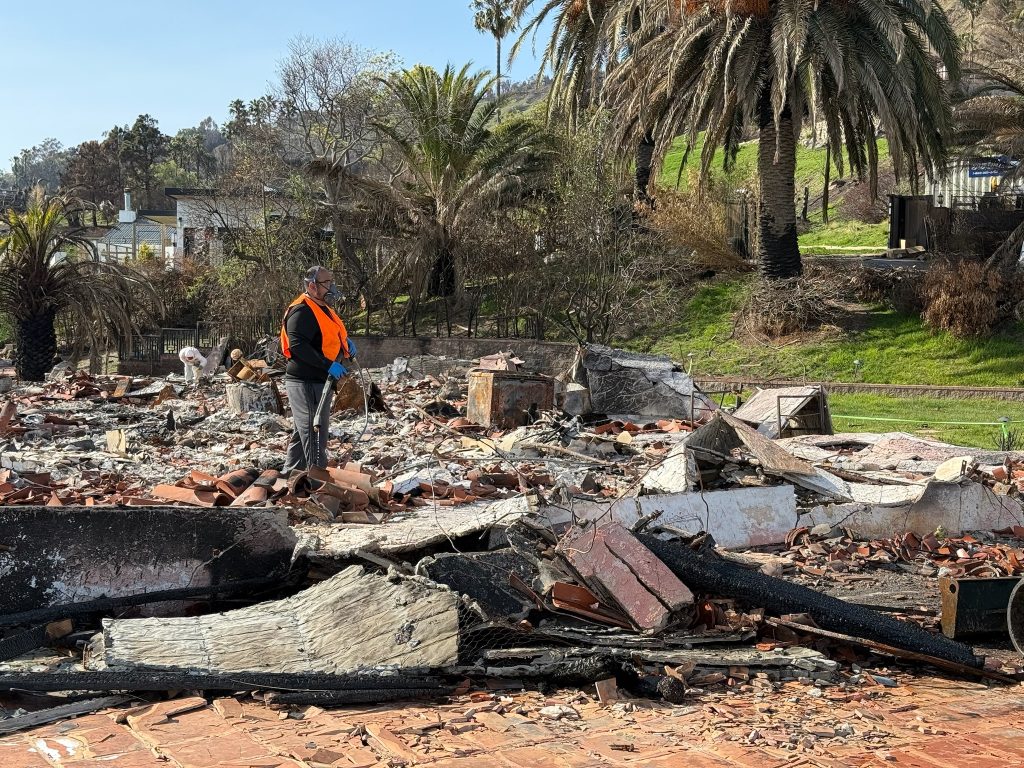 Cleaning the ash before fire restoration with a high pressure power washer