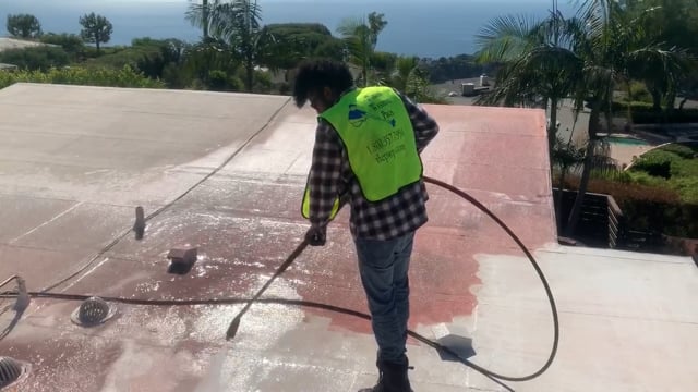 high pressure washer implication on a flat concrete roof